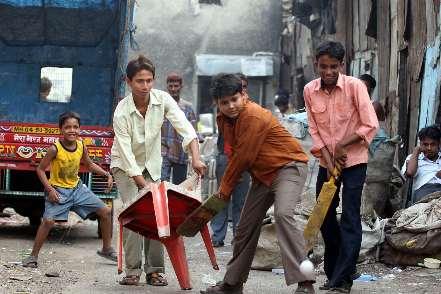 boys playing cricket in lanes