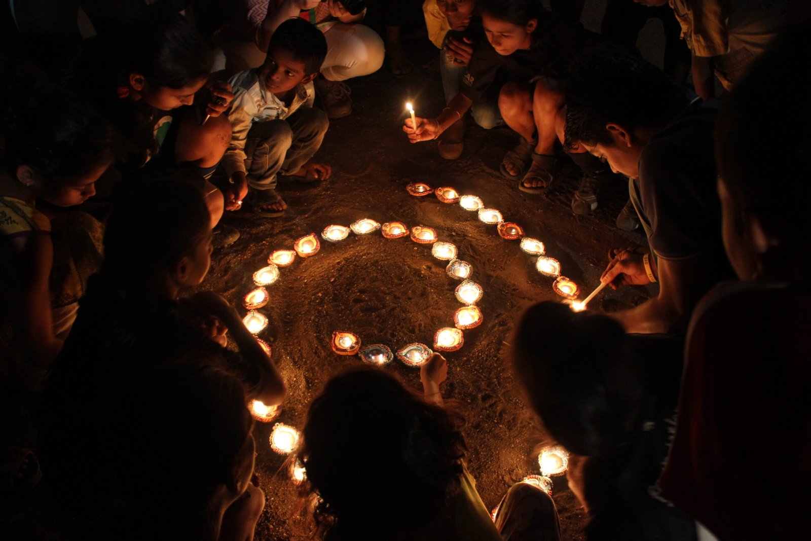 Sanjay Colony Diwali Tour picture where kids are llighting diyas