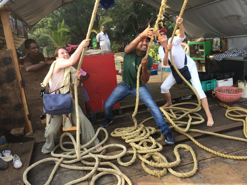 our tourists Reeling in fishing nets with the locals in the colonial town of Kochi