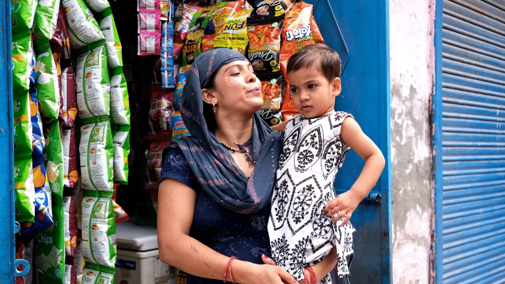 n Indian woman holds her young daughter close in her arms and performs the ancient thu thu thu ritual — a cultural practice believed to shield children from the evil eye. This protective gesture, often done by mothers, reflects deep-rooted traditions of love, care, and safeguarding family from negative energies.