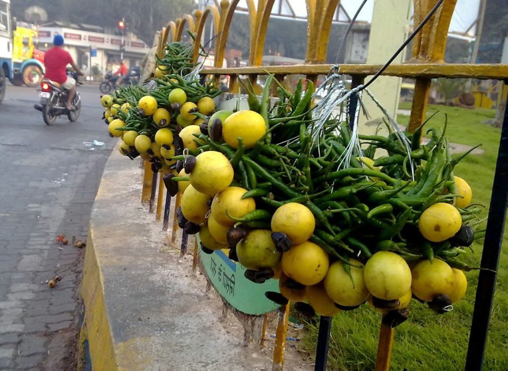 Bundles of lemon and chilli hangings sold in markets as a traditional Indian remedy against nazar