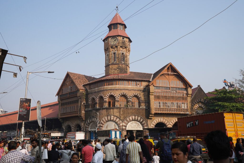 The image shows the historic Crawford Market in Mumbai, India, which is officially known as Mahatma Jyotiba Phule Mandal.