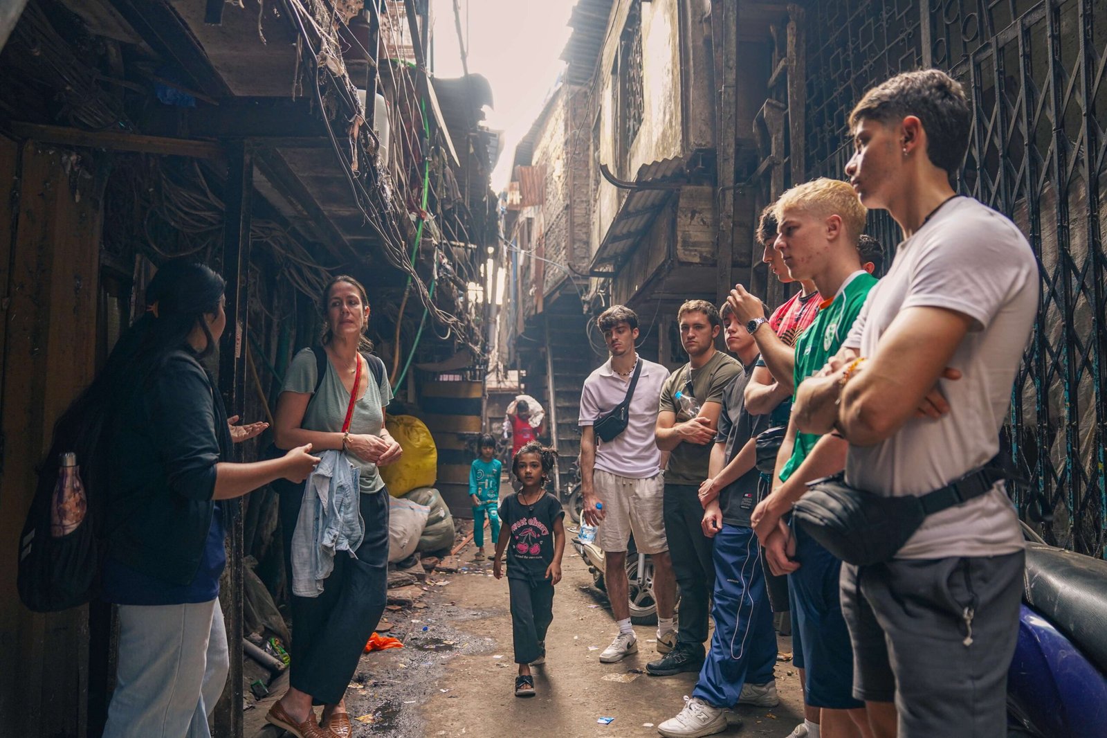 International Tourists walking through a narrow residential lane on an educational school and college tour with Reality Tours & Travel